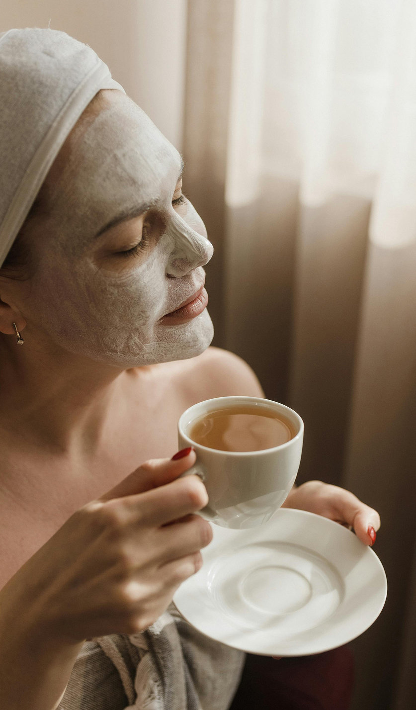 young-woman-having-face-massage-relaxing-spa-salon 1